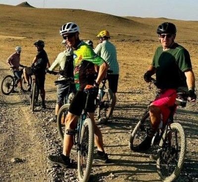 Peter Carey Cycling on the  tour with redspokes